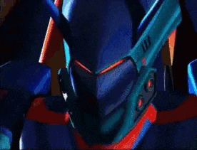a close up of a blue robot with red eyes and a red and blue background .