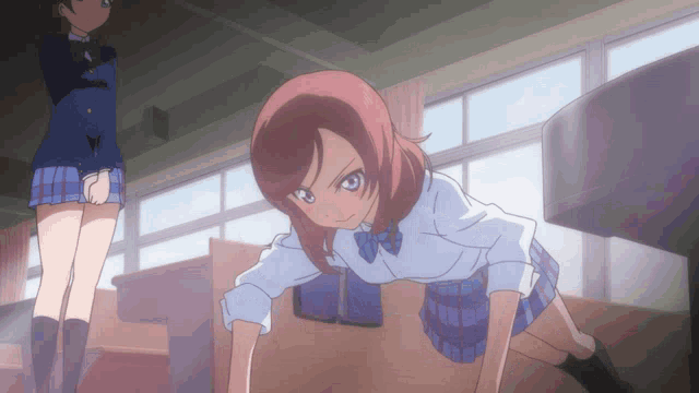 a girl in a blue and white plaid skirt is kneeling down