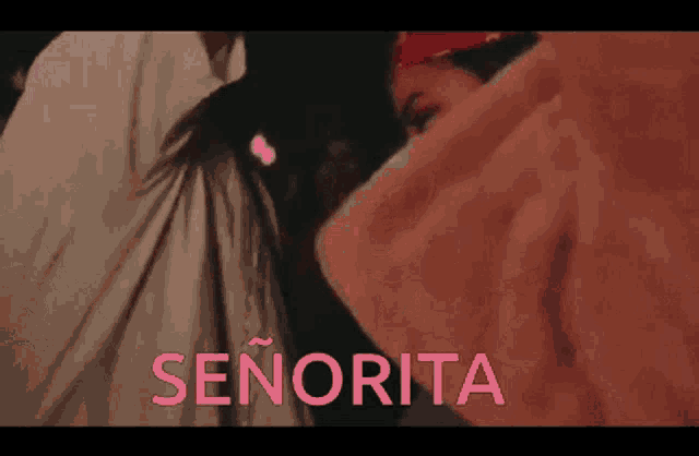 a man and a woman are standing next to each other and the word senorita is on the bottom