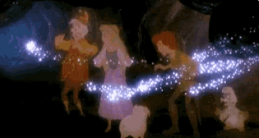 a group of people are standing next to each other in a dark room with a sheep .