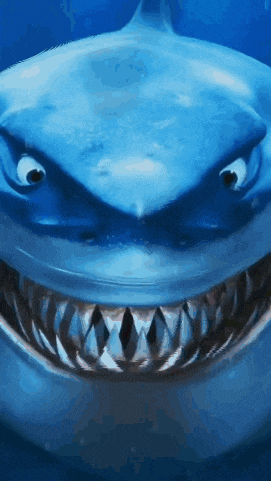 a close up of a shark 's mouth and teeth