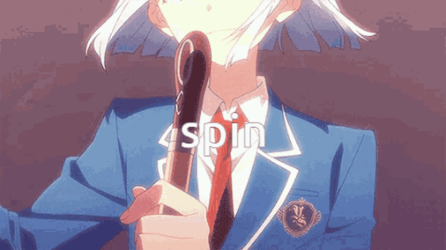 a girl in a school uniform is holding a cane and the word spin is visible above her