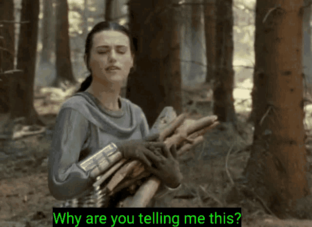 a woman is holding a pile of logs in the woods and says why are you telling me this