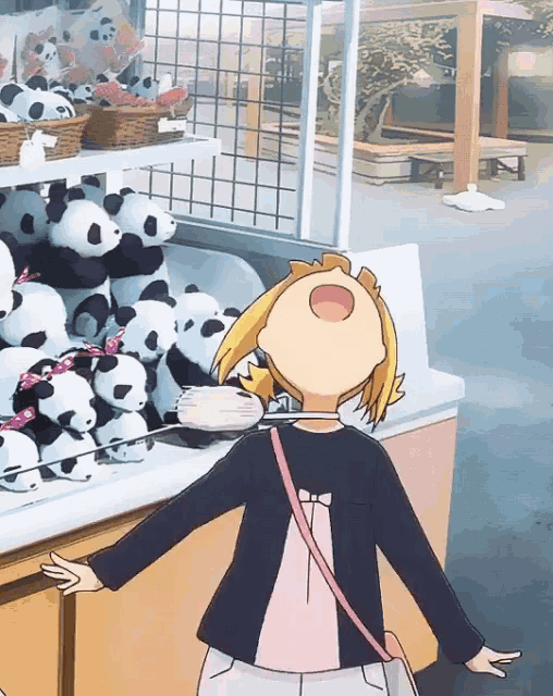 a girl is looking at stuffed panda bears on a shelf
