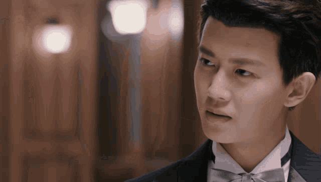 a man in a tuxedo with a bow tie