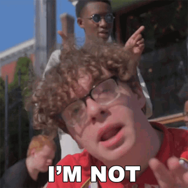 a young man with glasses says i 'm not