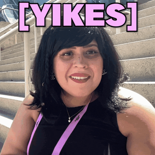 a woman with a lanyard that says ' adidas ' on it smiles