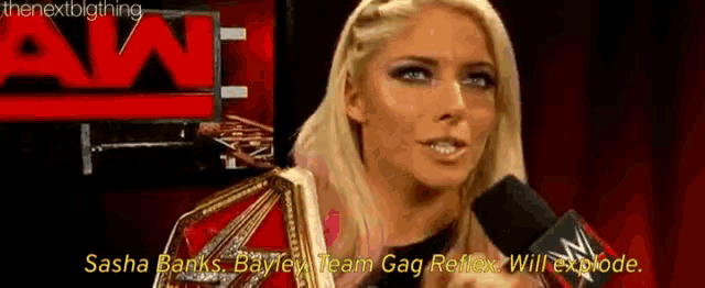 a woman is talking into a microphone with the words `` sasha banks bayley team gag reflex will explode '' .