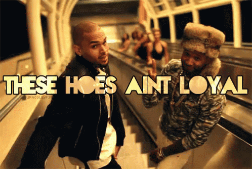these hoes ain 't loyal written on a picture of two men on an escalator