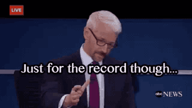 a man in a suit and tie is saying just for the record though ..