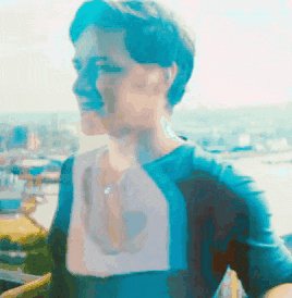 a blurry picture of a woman in a blue jacket