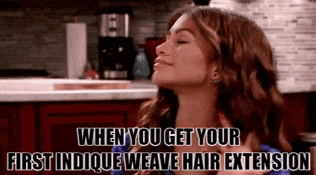 a woman in a kitchen with the words when you get your first indicque weave hair extension