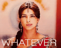a woman in a red dress is standing in front of the word whatever .