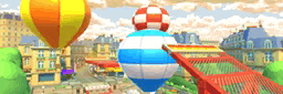 a bunch of hot air balloons floating over a city