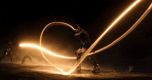 a woman in a superhero costume is holding a lightning bolt