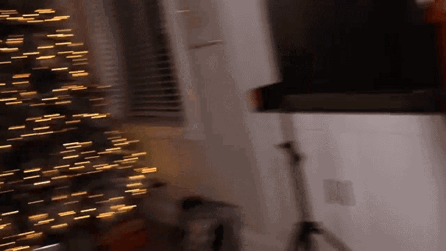 a blurry picture of a christmas tree with lights on it