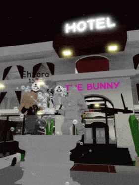 a white bunny is standing in front of a hotel sign