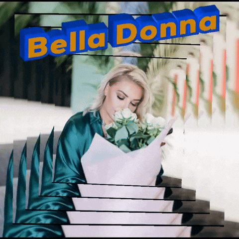 a woman is holding a bouquet of flowers and the words bella donna are behind her