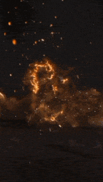 a large explosion with a lot of smoke coming out of it .