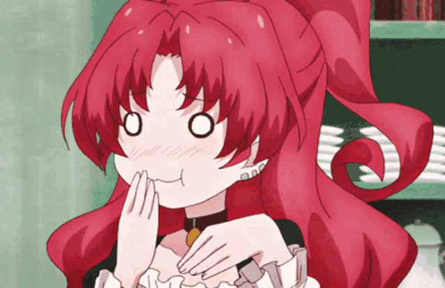 a girl with red hair is making a face with her hands