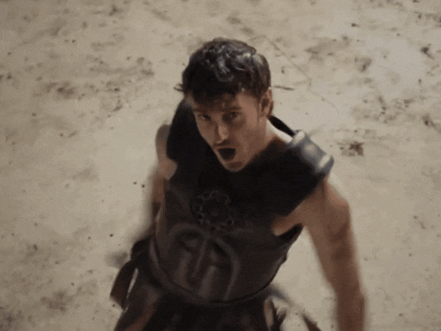 a man in a black armor with the letter u on the front