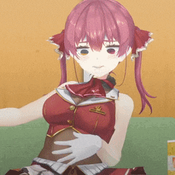 a girl with pink hair is sitting on a couch with her hands on her stomach