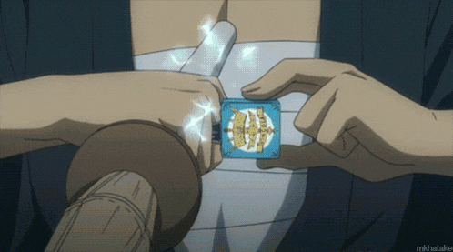 a person is holding a blue box with a gold emblem