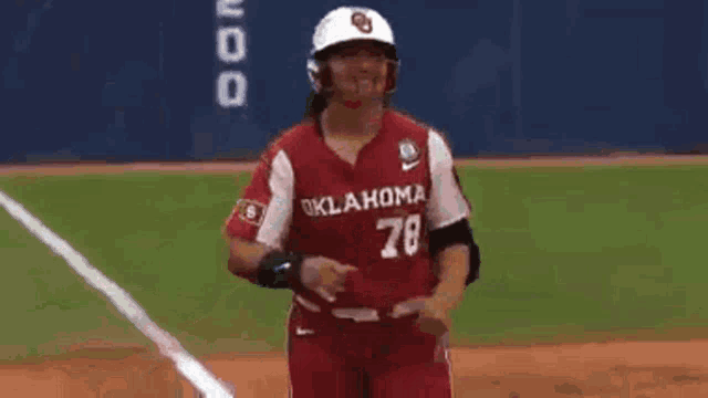 a baseball player wearing an oklahoma jersey with the number 78 on it .
