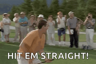 a man is swinging a golf club on a golf course in front of a crowd of people .