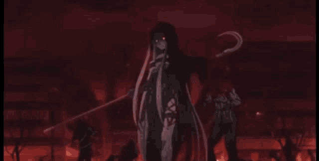 a woman with long hair is standing in a dark room with a red light behind her