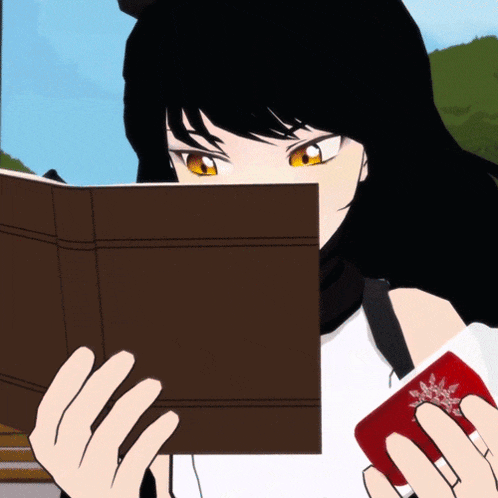 a girl with black hair is reading a book and holding a red card with a snowflake on it