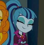 a close up of a cartoon character with blue hair smiling .
