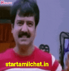 a man with a mustache is wearing a red shirt that says starttamilchat.in on it .