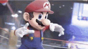 a mario cartoon character is standing in a boxing ring with his arms outstretched .