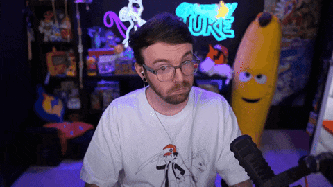 a man wearing glasses and headphones stands in front of a sign that says ' ture '