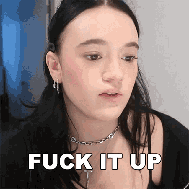 a woman says fuck it up while wearing a necklace