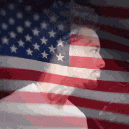 a man is standing in front of an american flag ..