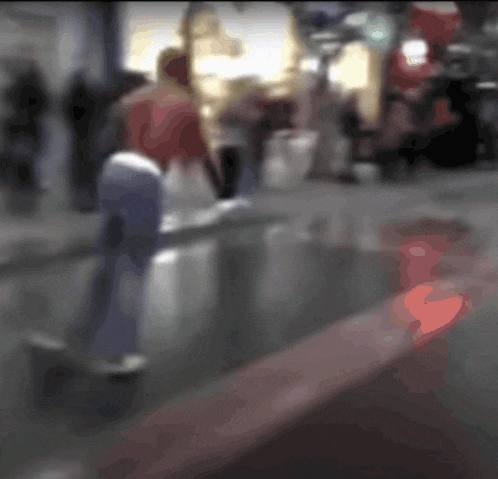 a blurry picture of people walking down a sidewalk