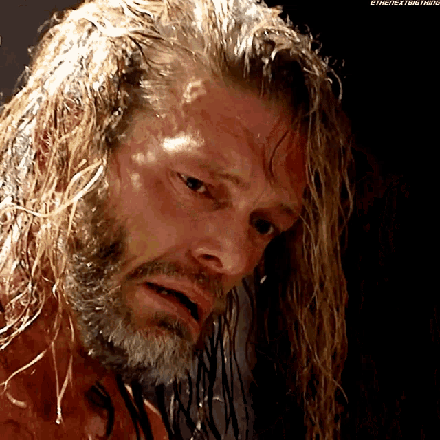 a close up of a wrestler 's face with the hashtag #thenextbigthing