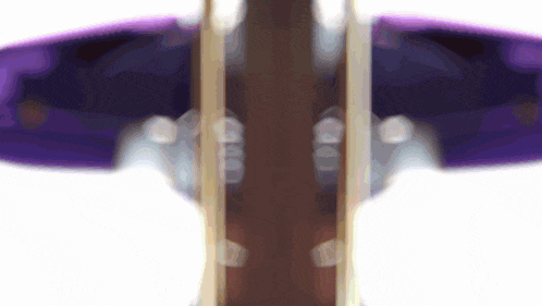 a blurry picture of a purple and brown object with the numbers 00 on it