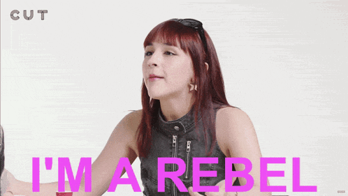 a woman says i 'm a rebel while wearing sunglasses