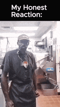 a man wearing a hat that says wendy 's is standing in a kitchen