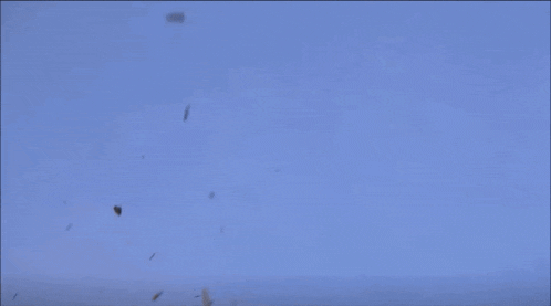 a man is flying through the air with a sword in his hand