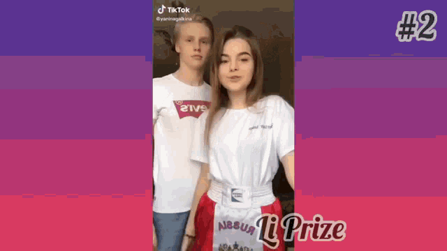 a boy and a girl are standing next to each other and the girl is wearing a red skirt .