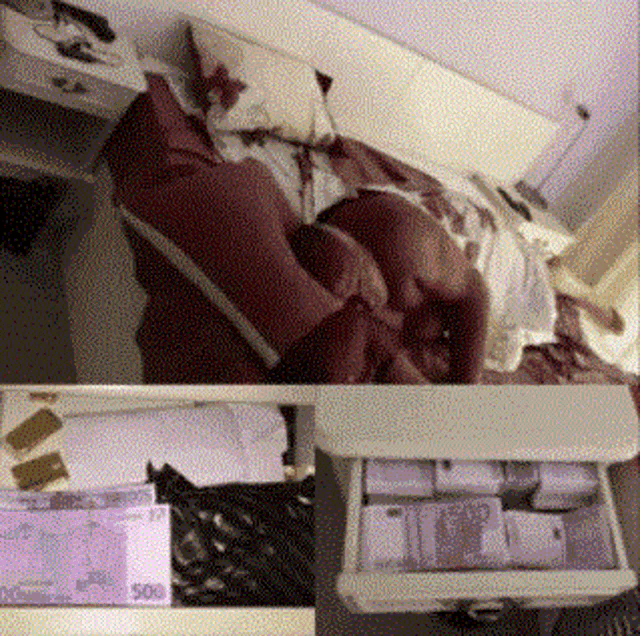 a person laying on a bed next to a drawer filled with money
