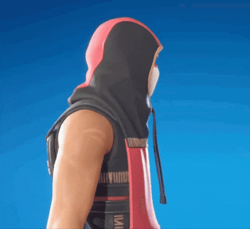 a man with a mask on his face is wearing a pink and black hoodie