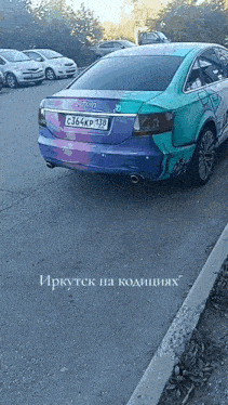 a multicolored car with a license plate that says c364kp138