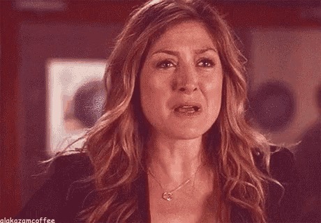 a woman is crying and making a funny face .