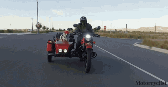 a man is riding a red motorcycle with a sidecar and the word motorcyclist is on the bottom