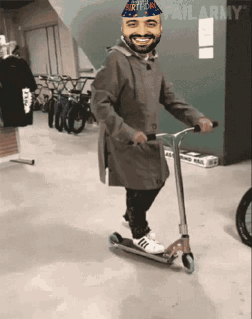 a man riding a scooter with a birthday hat on his head